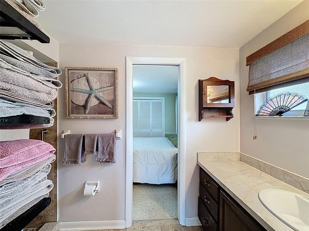 1602 Alder Way Brandon, FL 33510 - Photo 35 of 64 a bedroom with a bed and a flat tv screen on dresser