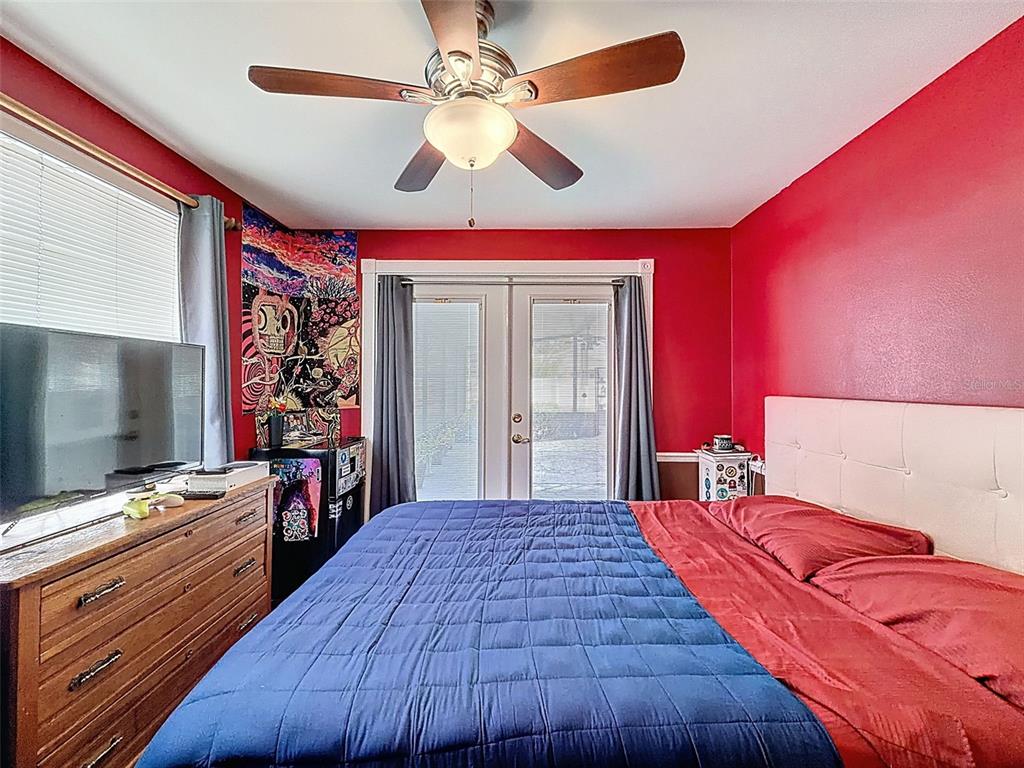 1602 Alder Way Brandon, FL 33510 - Photo 41 of 64 a bedroom with a bed and a flat screen tv