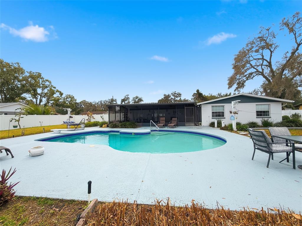 1602 Alder Way Brandon, FL 33510 - Photo 47 of 64 a view of a swimming pool with lounge chair