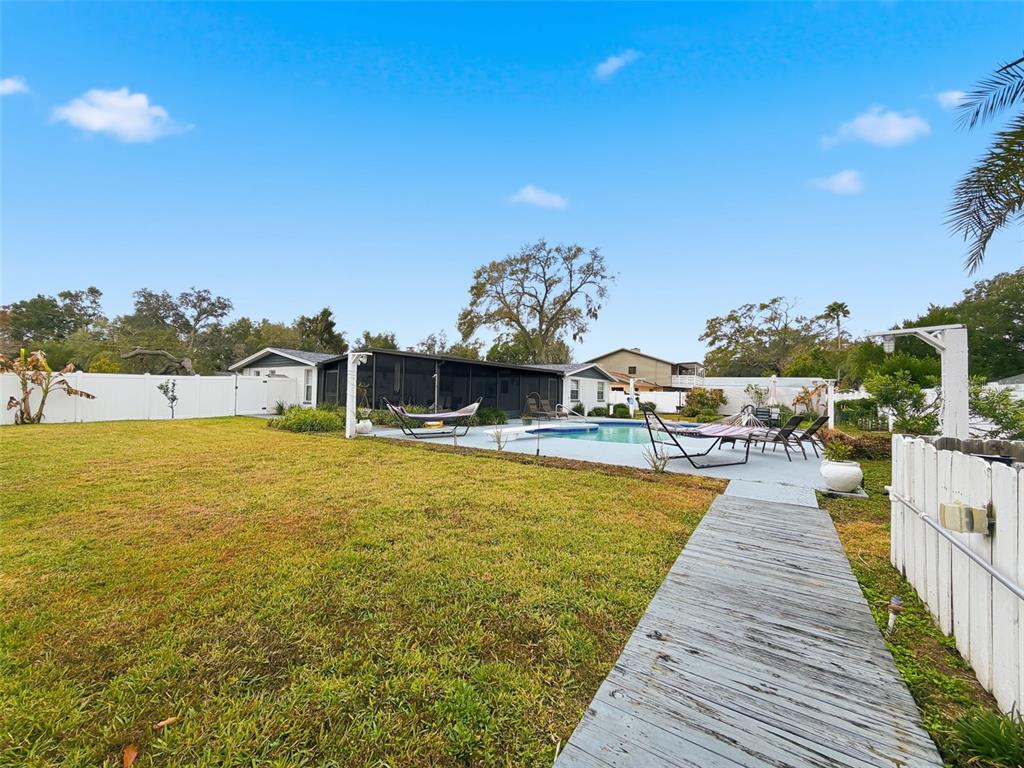 1602 Alder Way Brandon, FL 33510 - Photo 49 of 64 a view of a swimming pool with an ocean view