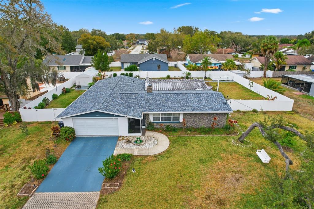 1602 Alder Way Brandon, FL 33510 - Photo 61 of 64 a aerial view of a house with swimming pool and big yard