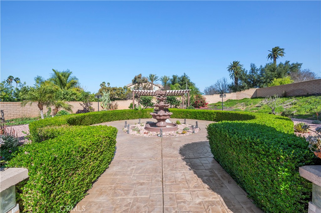 12810 Sierra Creek Drive Riverside, CA 92503 - Photo 14 of 52 a view of a garden with a patio