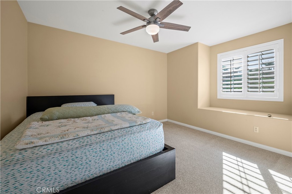 12810 Sierra Creek Drive Riverside, CA 92503 - Photo 19 of 52 a bedroom with a bed and a window