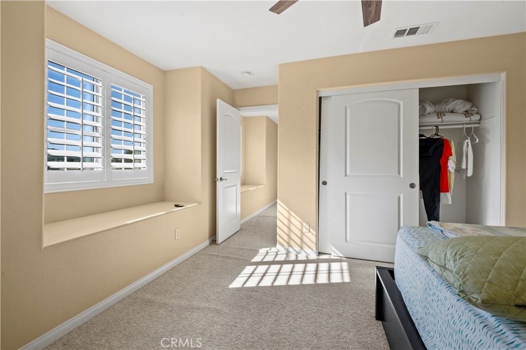 12810 Sierra Creek Drive Riverside, CA 92503 - Photo 20 of 52 a bedroom with a bed and a window