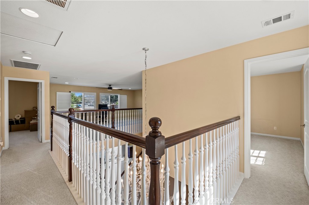 12810 Sierra Creek Drive Riverside, CA 92503 - Photo 22 of 52 a view of a hallway with a hallway