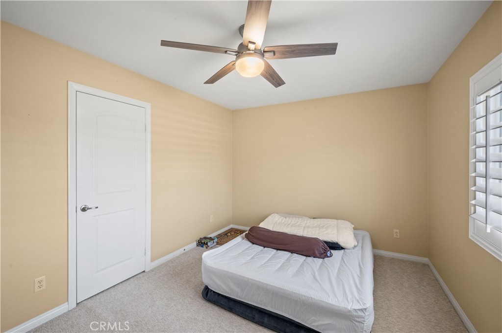 12810 Sierra Creek Drive Riverside, CA 92503 - Photo 24 of 52 a bedroom with a bed and a window