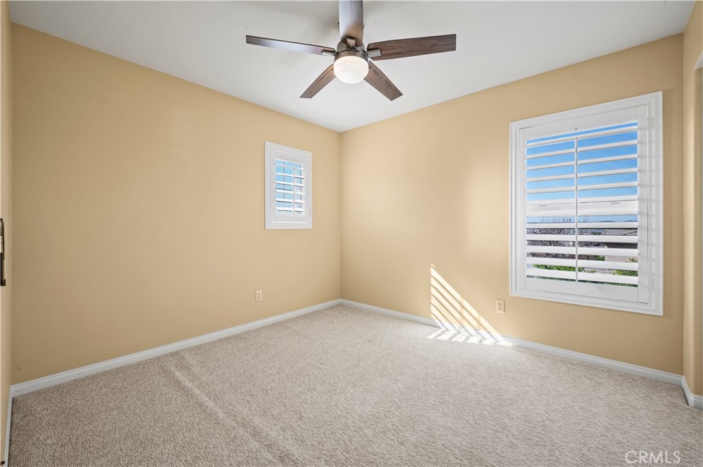 12810 Sierra Creek Drive Riverside, CA 92503 - Photo 28 of 52 a view of an empty room with a window