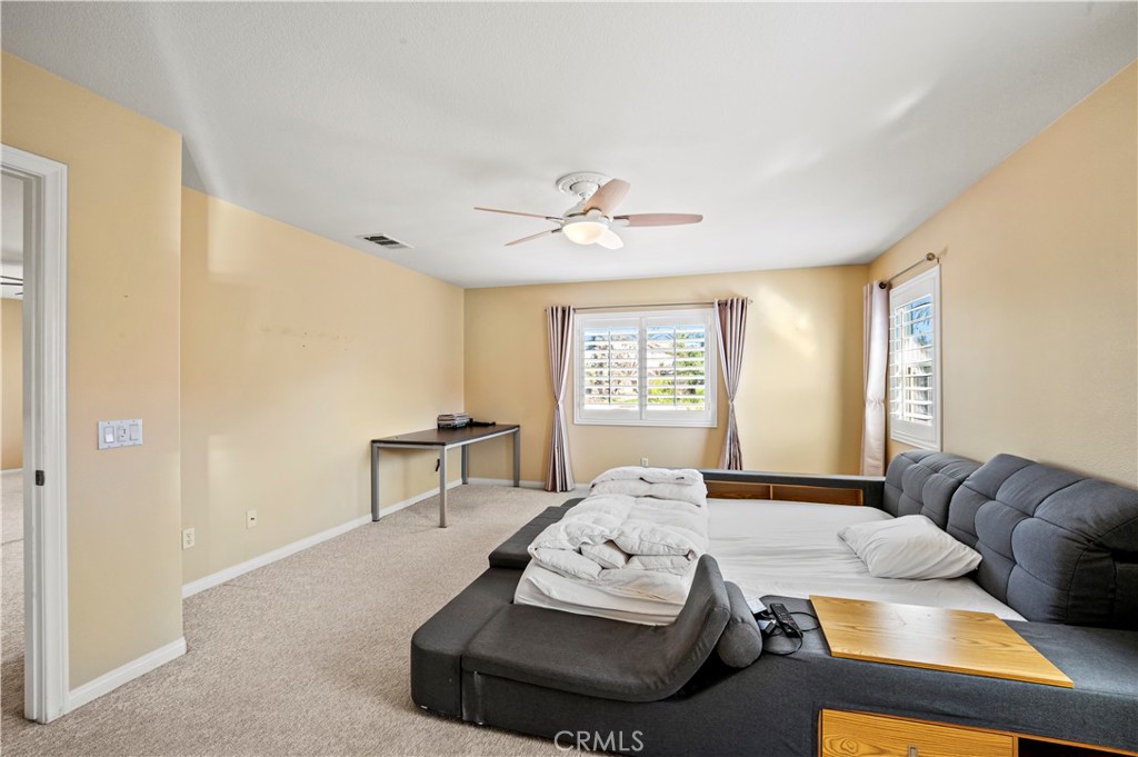 12810 Sierra Creek Drive Riverside, CA 92503 - Photo 36 of 52 a living room with furniture and a window