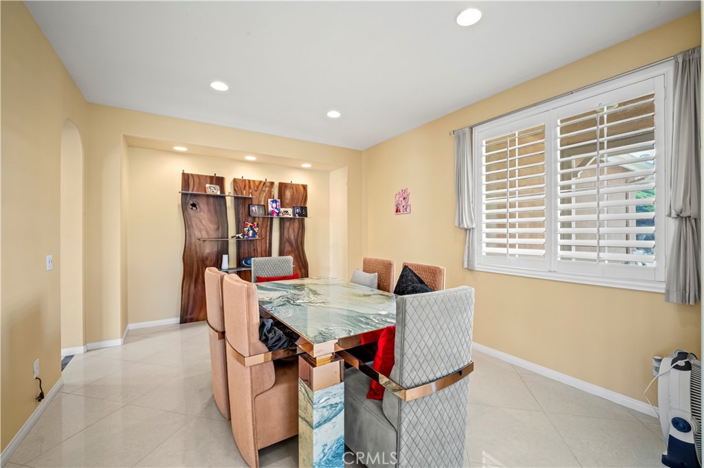 12810 Sierra Creek Drive Riverside, CA 92503 - Photo 46 of 52 a view of a dining room with furniture and window