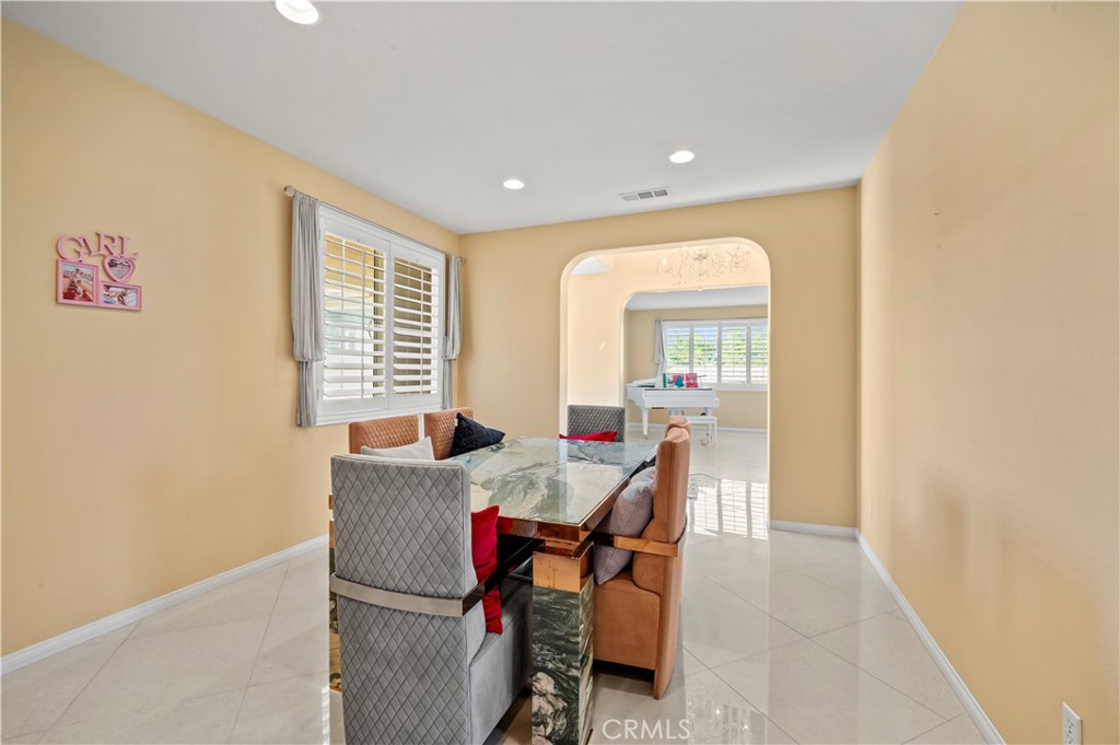 12810 Sierra Creek Drive Riverside, CA 92503 - Photo 48 of 52 a view of a dining room with furniture and window