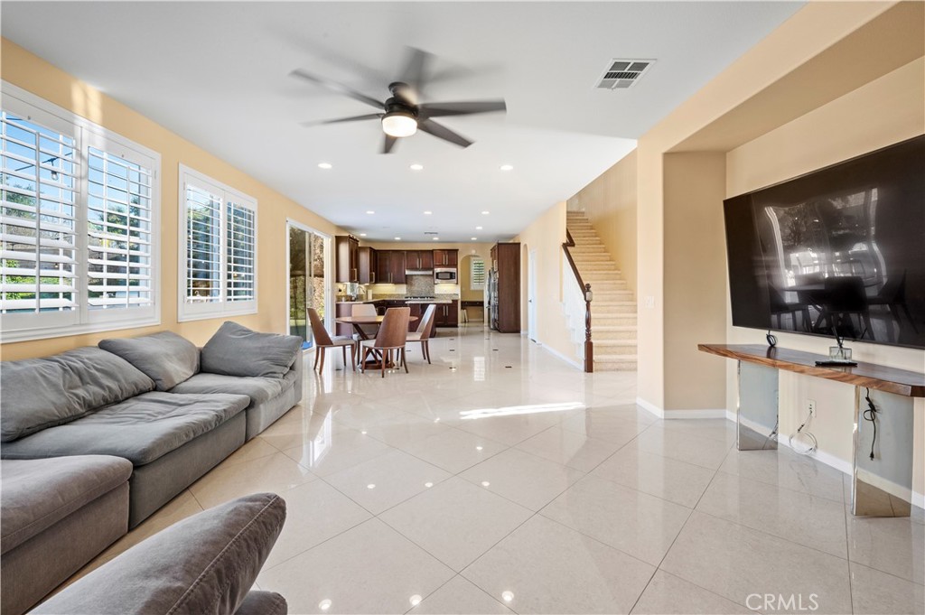 12810 Sierra Creek Drive Riverside, CA 92503 - Photo 7 of 52 a living room with furniture and a flat screen tv