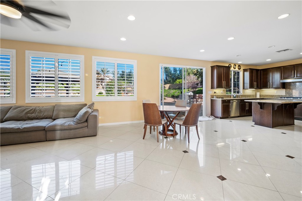 12810 Sierra Creek Drive Riverside, CA 92503 - Photo 9 of 52 a living room with furniture and large windows