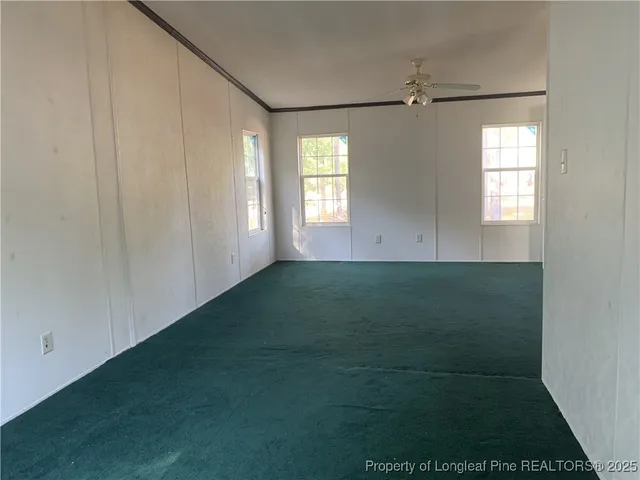 a view of room with window and hardwood floor