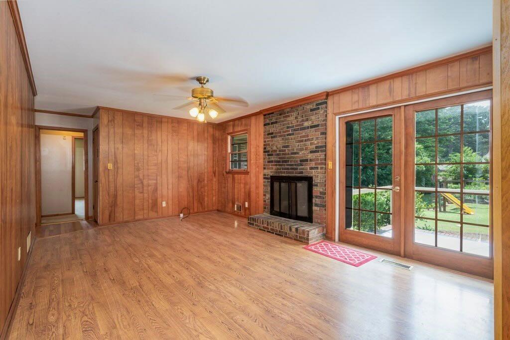 3854 Ridgewood Drive Southeast Smyrna, GA 30080 - Photo 15 of 40 a view of an empty room with a fireplace and a window