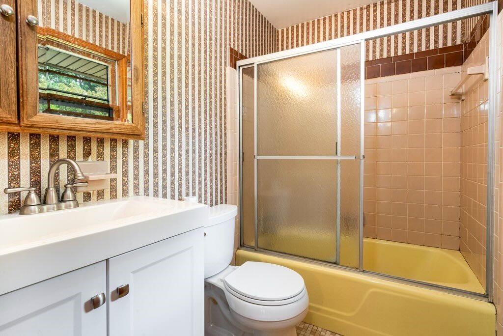 3854 Ridgewood Drive Southeast Smyrna, GA 30080 - Photo 26 of 40 a bathroom with a sink toilet and shower