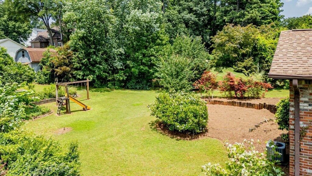 3854 Ridgewood Drive Southeast Smyrna, GA 30080 - Photo 34 of 40 a view of swimming pool with lawn chairs and plants