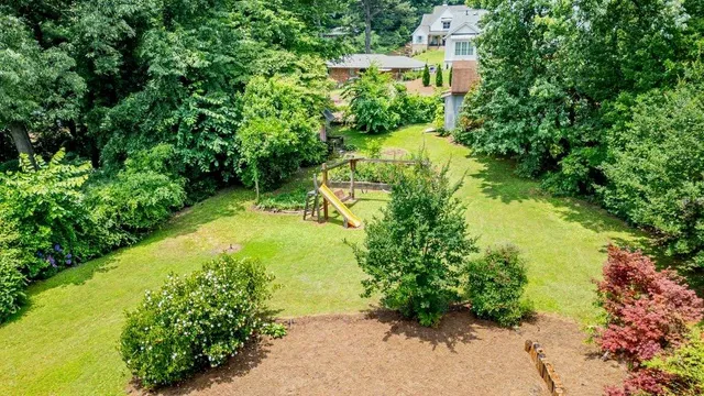 a view of a garden with a building