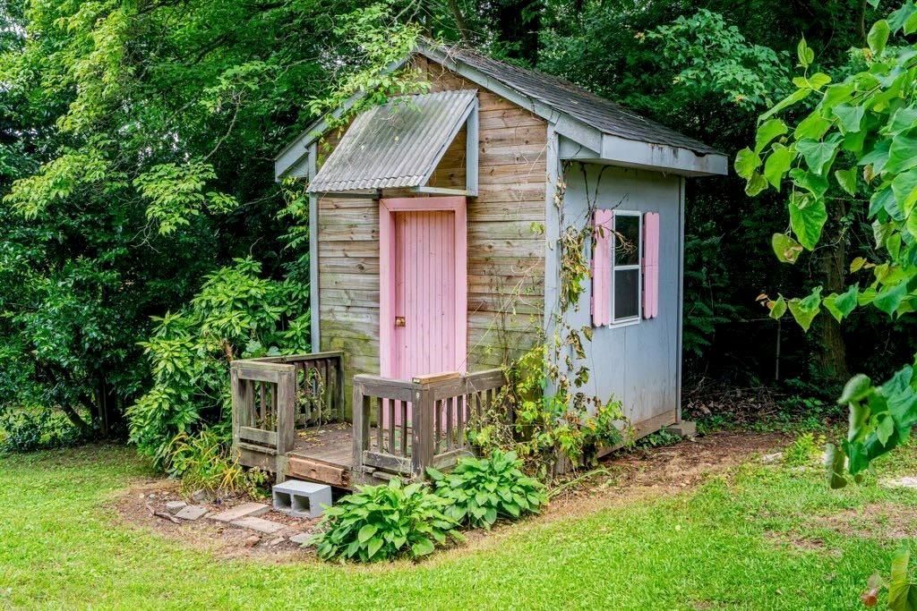 3854 Ridgewood Drive Southeast Smyrna, GA 30080 - Photo 38 of 40 a front view of a house with garden