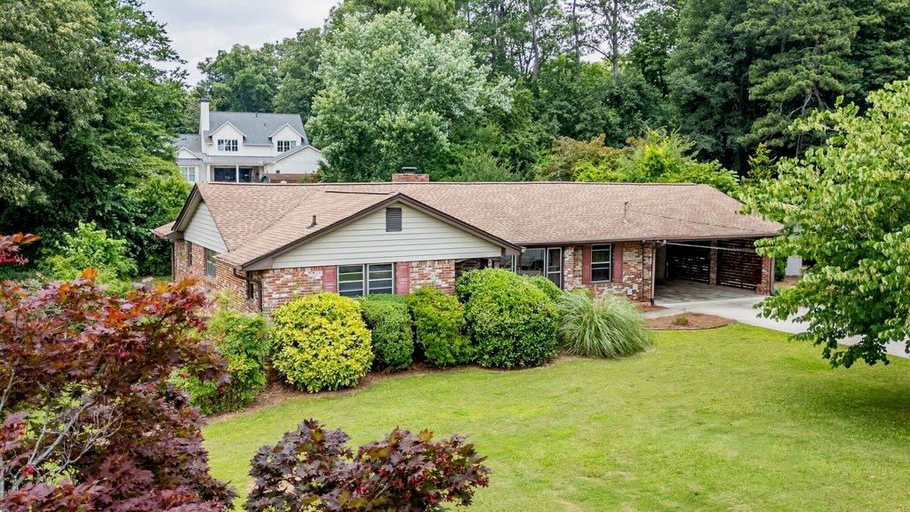 3854 Ridgewood Drive Southeast Smyrna, GA 30080 - Photo 5 of 40 aerial view of a house with a yard and potted plants