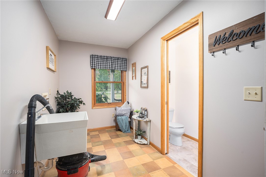 2073 Sexton Road Austinburg, OH 44010 - Photo 24 of 32 Laundry room with tile patterned floors and hookup for a washing machine