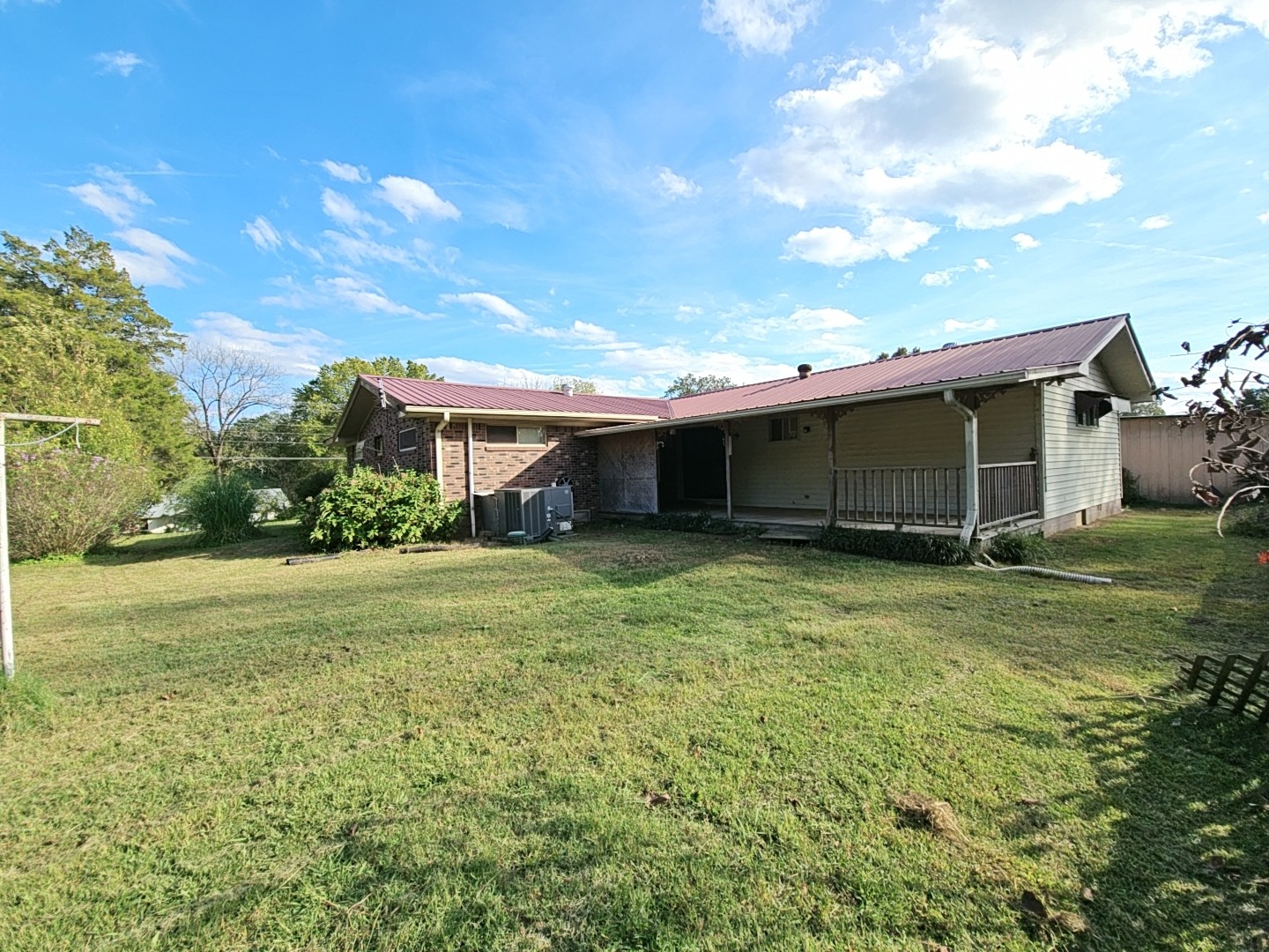 2122 Old Decaturville Road Parsons, TN 38363 - Photo 12 of 37 a front view of a house with a garden