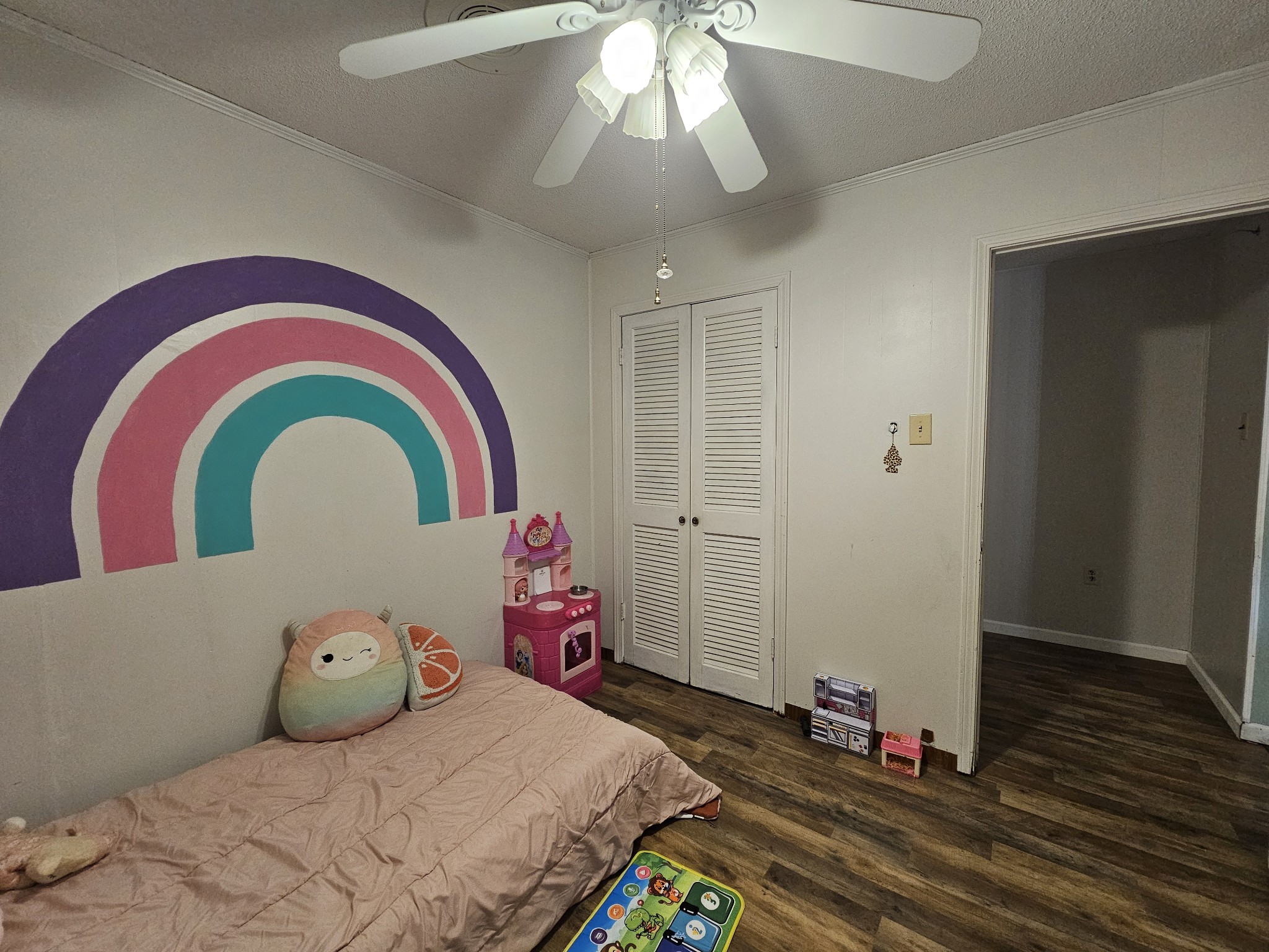 2122 Old Decaturville Road Parsons, TN 38363 - Photo 23 of 37 a bedroom with a bed and a chandelier