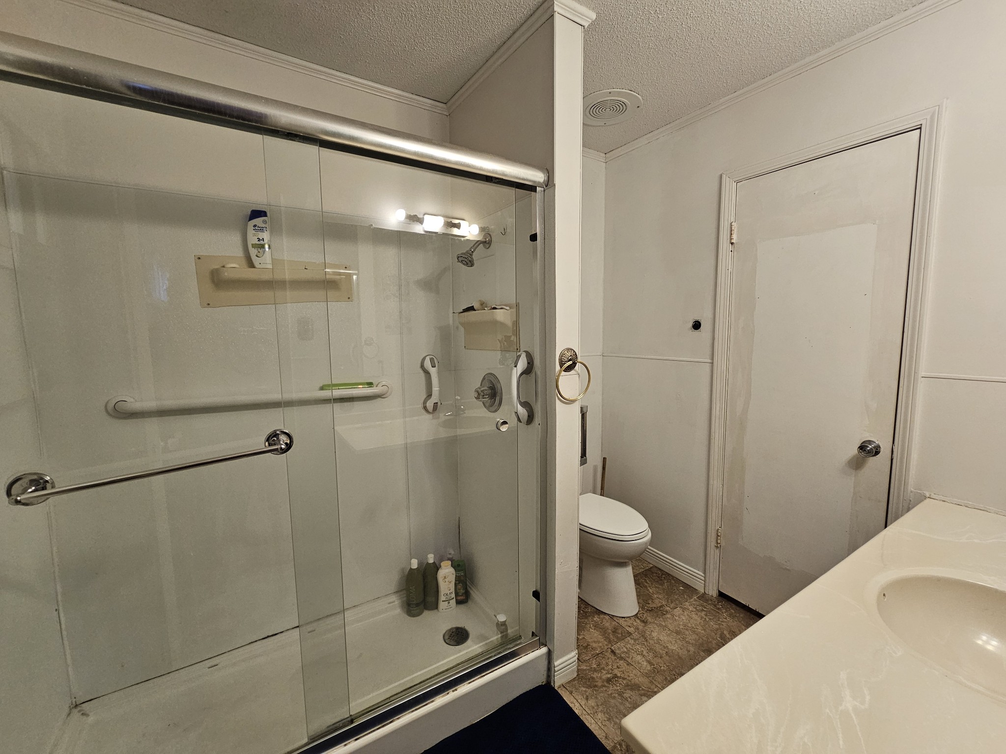 2122 Old Decaturville Road Parsons, TN 38363 - Photo 28 of 37 a bathroom with a shower and a toilet