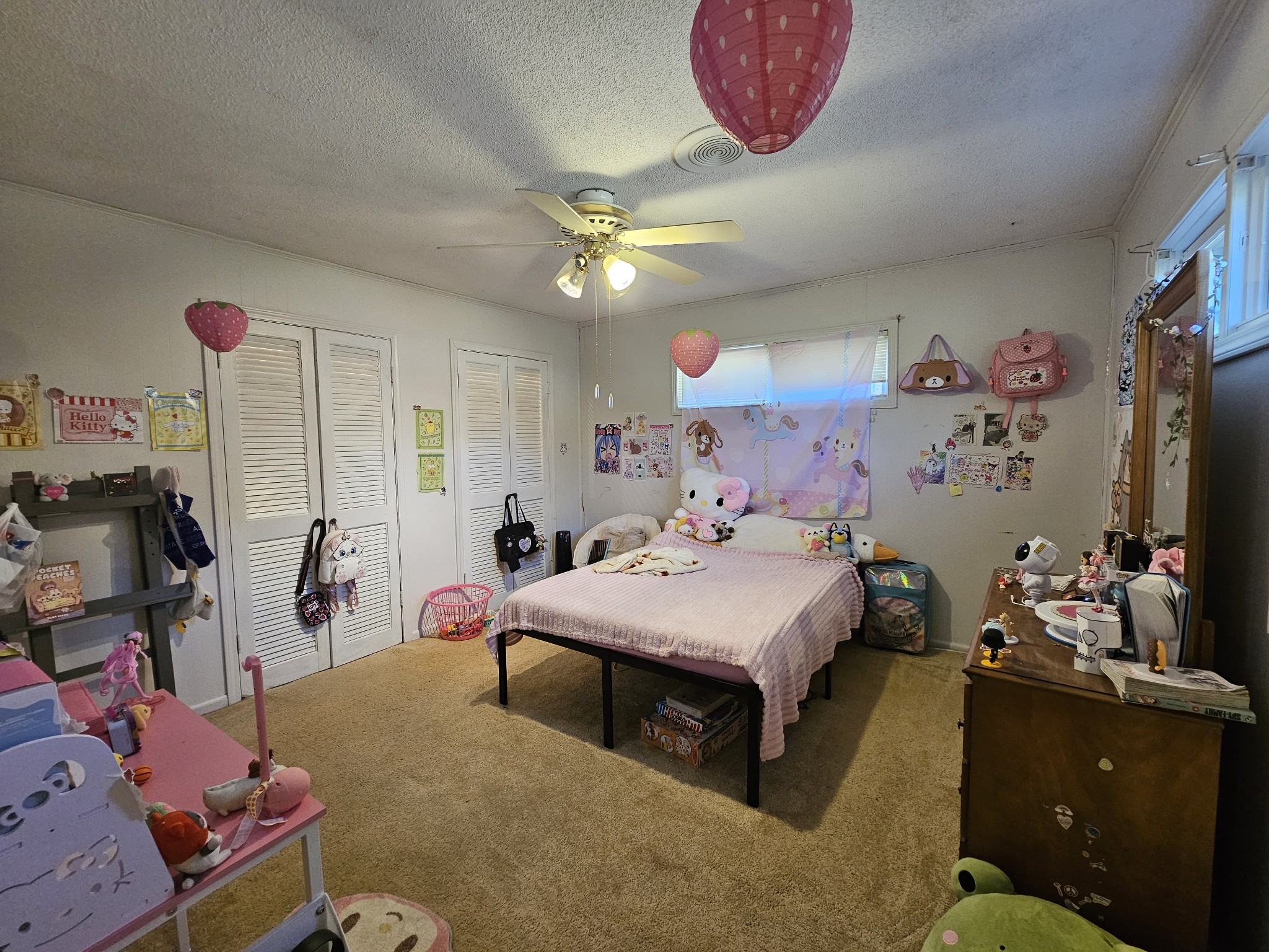 2122 Old Decaturville Road Parsons, TN 38363 - Photo 29 of 37 a bedroom with a bed and a chandelier