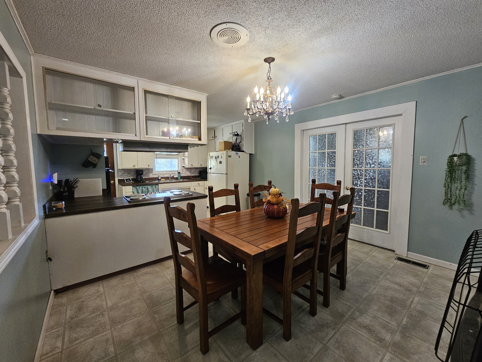 2122 Old Decaturville Road Parsons, TN 38363 - Photo 30 of 37 a view of a dining room with furniture and chandelier