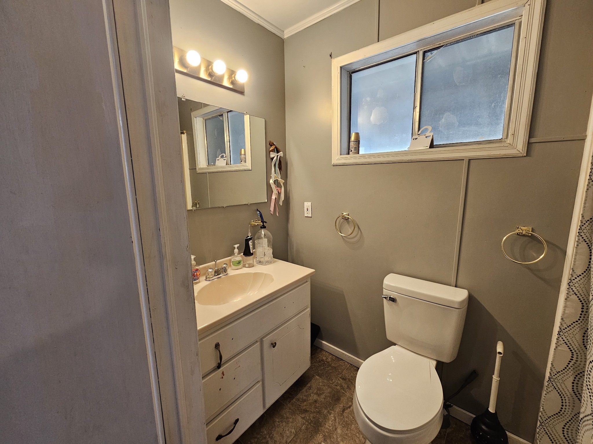 2122 Old Decaturville Road Parsons, TN 38363 - Photo 35 of 37 a white toilet sitting next to a bathroom sink