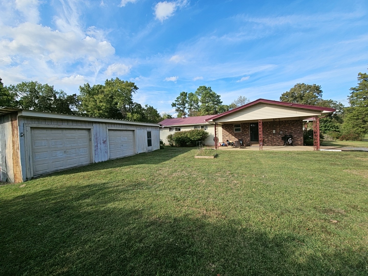 2122 Old Decaturville Road Parsons, TN 38363 - Photo 5 of 37 a front view of a house with garden