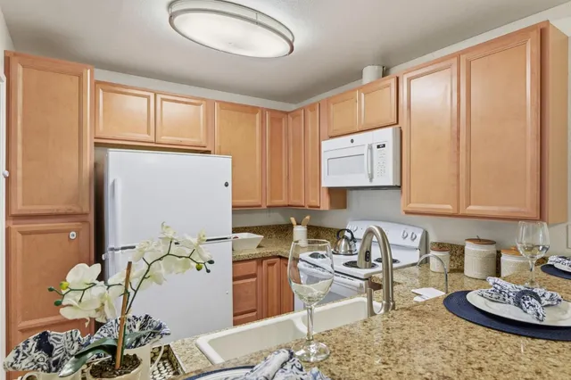 a room that has a couch and a stove in it