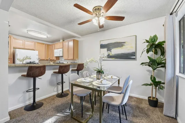 a view of a dining room with furniture window and outside view