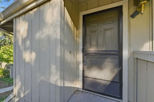 a bathroom with a glass shower door