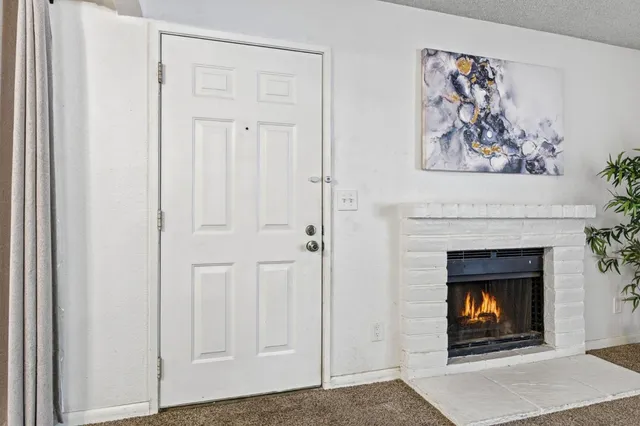 a view of a livingroom with a fireplace