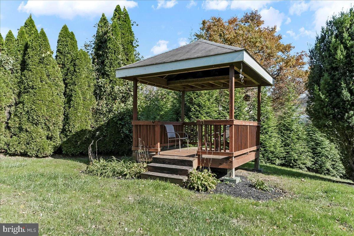 448 North Mill Road Kennett Square, PA 19348 - Photo 4 of 32 Charming gazebo nestled in lush greenery.