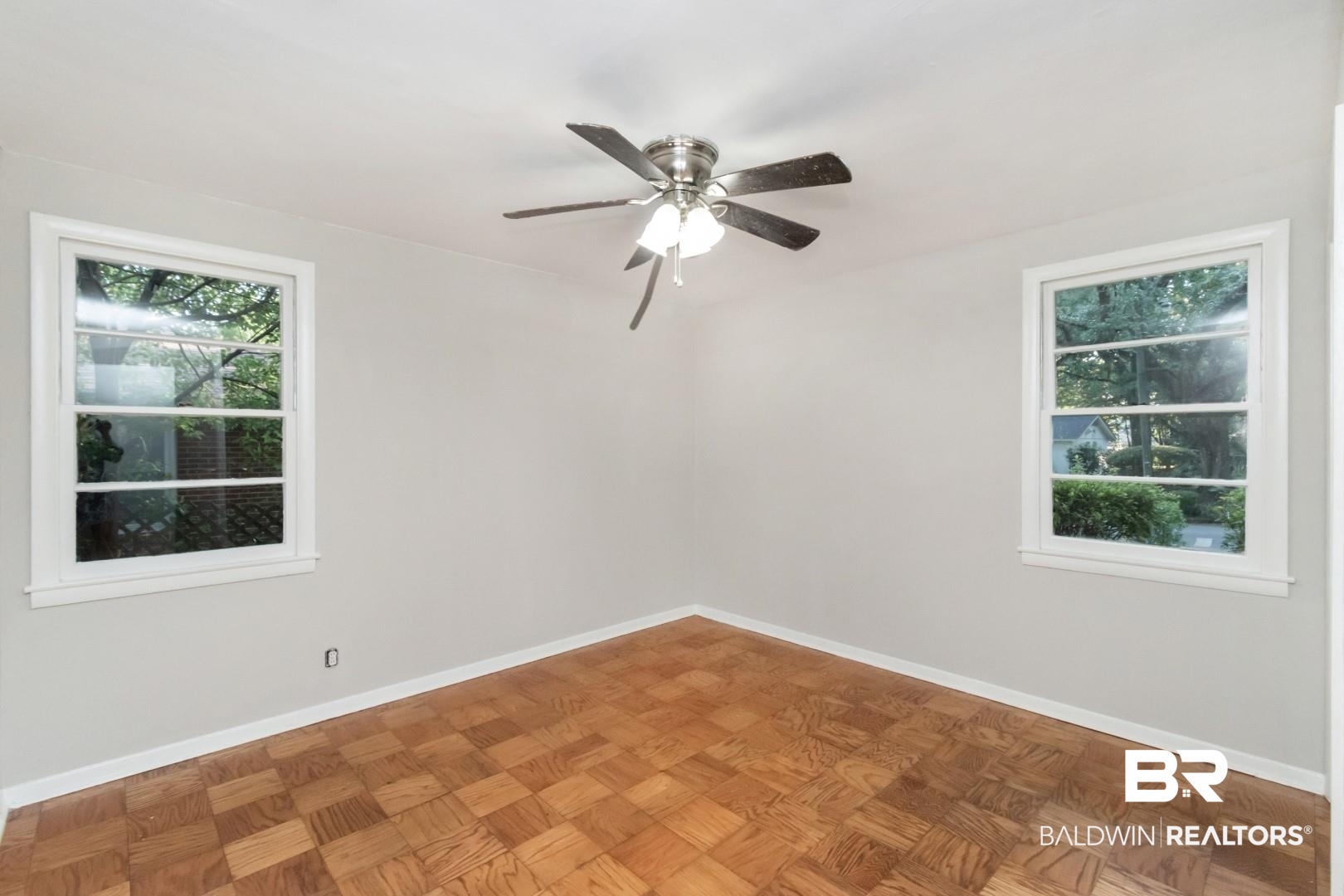 1220 Garland Drive Mobile, AL 36618 - Photo 18 of 25 Spare room featuring ceiling fan and parquet flooring