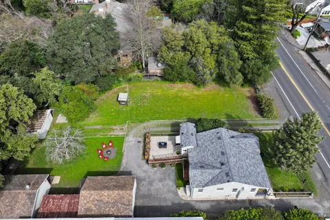 an aerial view of a house with outdoor space