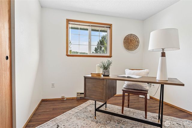 a bathroom with a sink toilet and a mirror