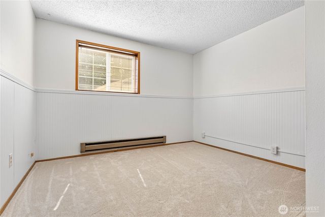 a view of a house with a chairs in patio