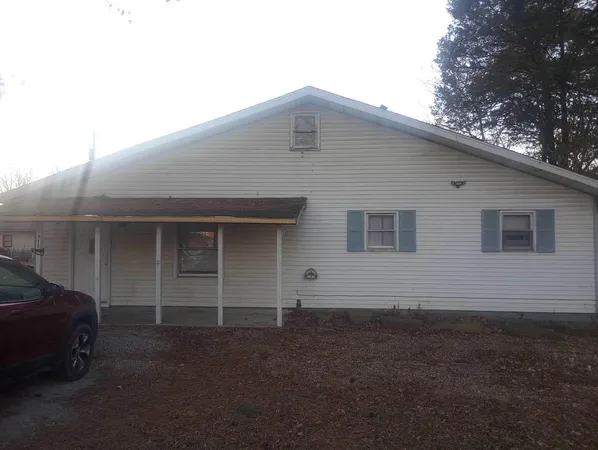 a front view of a house with garage
