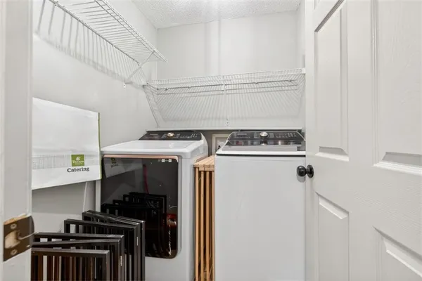 a utility room with washer and dryer