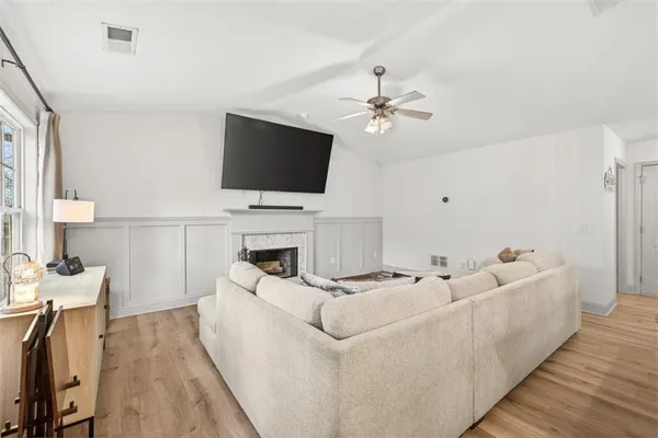 a living room with furniture and a flat screen tv