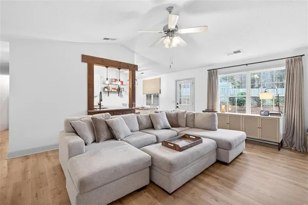 a living room with furniture and a large window