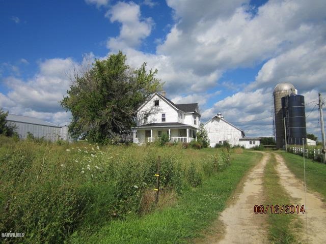 2405 North Henderson Road Freeport, IL 61032 - Photo 2 of 25 a front view of a house with a yard