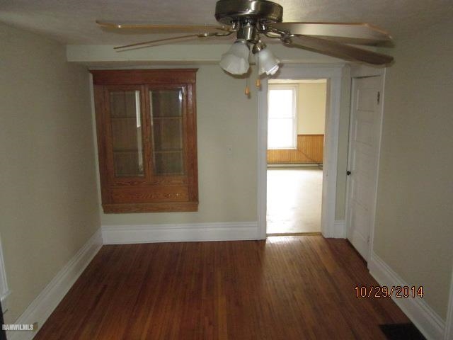 2405 North Henderson Road Freeport, IL 61032 - Photo 6 of 25 wooden floor in an empty room with a window