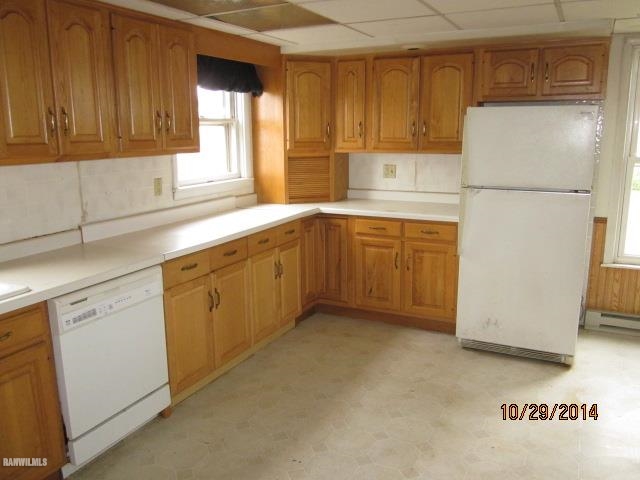 2405 North Henderson Road Freeport, IL 61032 - Photo 7 of 25 a kitchen with cabinets appliances a sink and a window