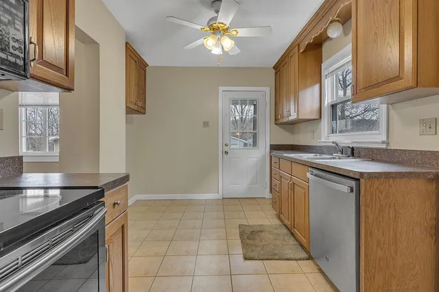 a kitchen with a sink appliances and cabinets