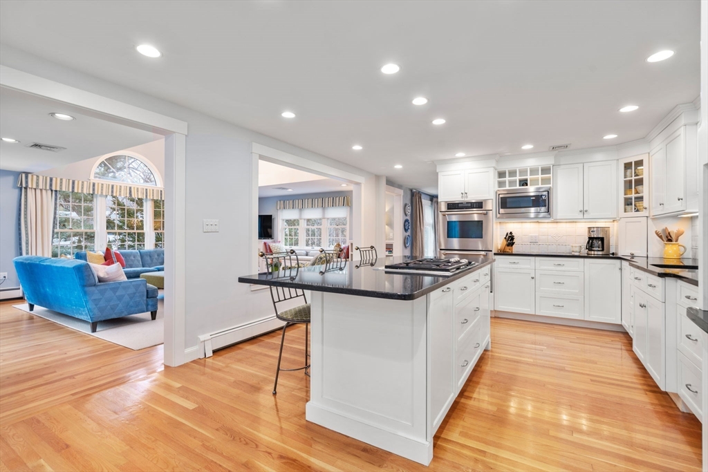 81 Woodfall Road Belmont, MA 02478 - Photo 12 of 37 a kitchen with stainless steel appliances granite countertop a sink and cabinets