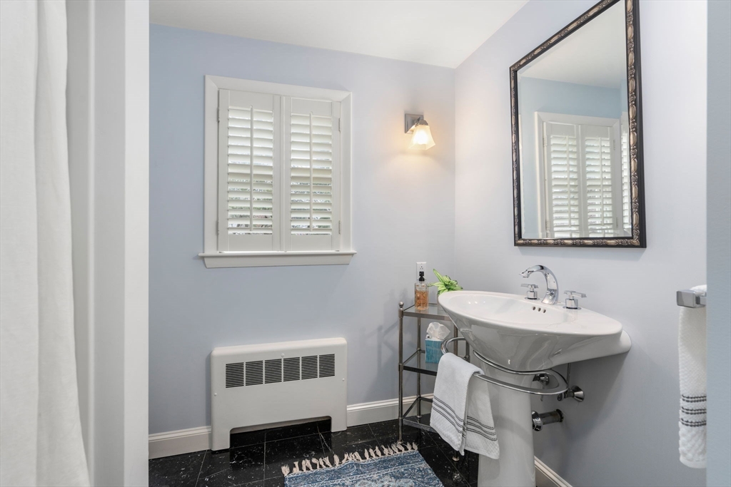 81 Woodfall Road Belmont, MA 02478 - Photo 19 of 37 a bathroom with a sink and a window